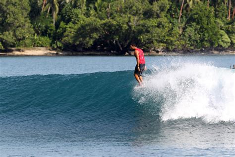 Surfing crystal waters in Papua New Guinea