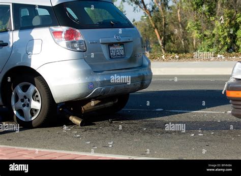 Car accident showing rear end damage to a compact car Stock Photo - Alamy