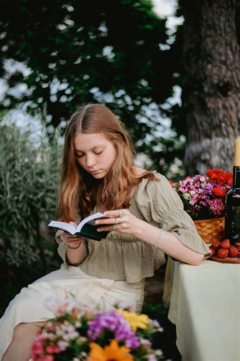 Portrait of a Pretty Girl Reading a Book · Free Stock Photo