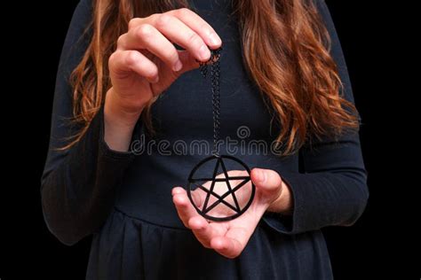 Woman in Black Dress with Pentagram Necklace on Black Stock Photo ...