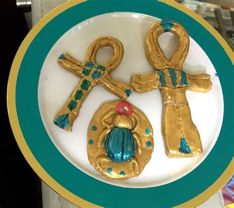 We saw this idea about how to make an Egyptian amulet (hint: you just use air-dry clay, ha ha ...