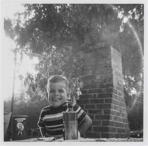 Smiling little boy sitting at a picnic table | Undated | simpleinsomnia | Flickr