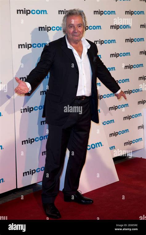 French actor Pierre Arditi, poses during a photocall for the film "Le sang de la vigne" at the ...