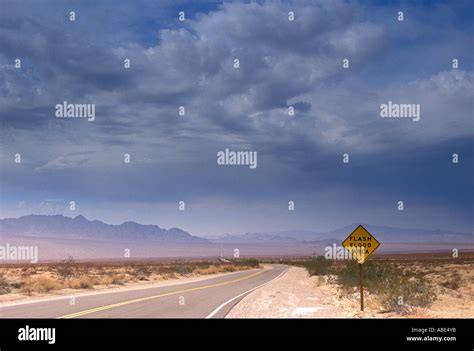 Flash flood warning signs during stormy weather on Highway 62 Mojave ...