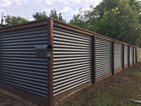 corrugated iron and hardwood fence | Metal fence panels, Corrugated metal fence, Fence design