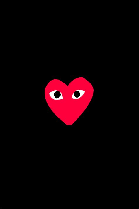 a red heart with two eyes in the dark