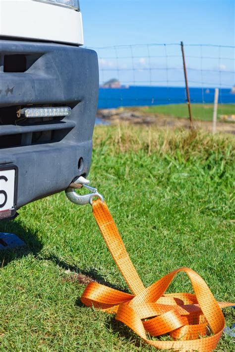 Tow Hook with Orange Strap on Car. Towing Equipment Stock Image - Image of hook, towing: 253503771