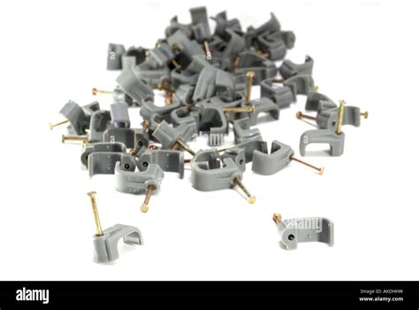 Grey electrical wiring cable clips Stock Photo - Alamy