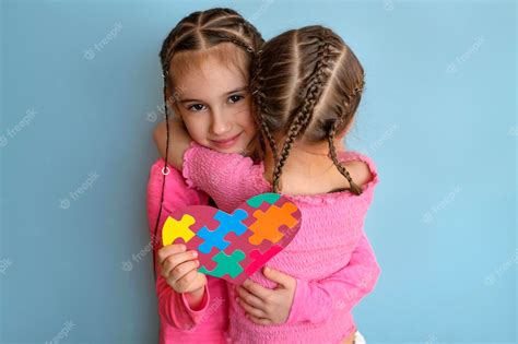 Premium Photo | Kid presented puzzle card to friend with an autism spectrum disorder