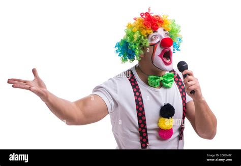 Funny clown with a microphone singing karaoke isolated on white background Stock Photo - Alamy