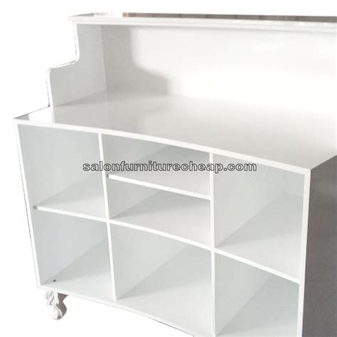 White curved reception desk