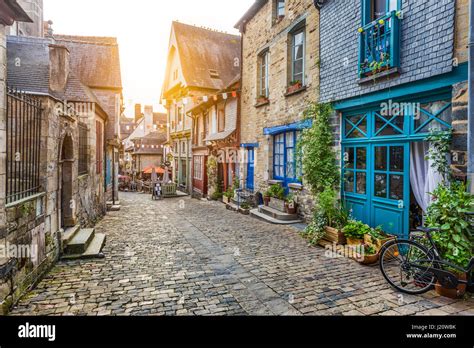 Panoramic view of a charming street scene in an old town in Europe in beautiful evening light at ...