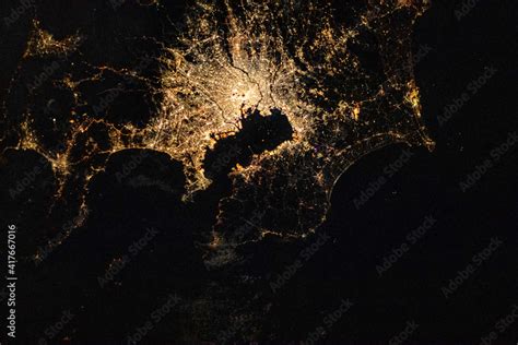 Satellite view of Tokyo at night. Digital Enhancement. Elements of this ...