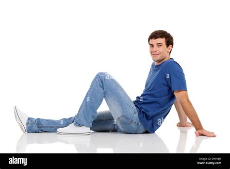 relaxed man sitting on the floor on white background Stock Photo ...