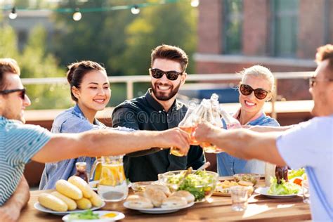 Happy Friends Toasting Drinks at Rooftop Party Stock Image - Image of hipster, bottle: 138187991