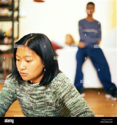 Young people in living room Stock Photo - Alamy