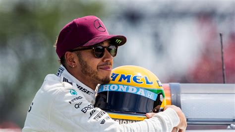 Why Lewis Hamilton dons yellow helmet? Exploring the meaning behind his iconic headgear - Sportszion