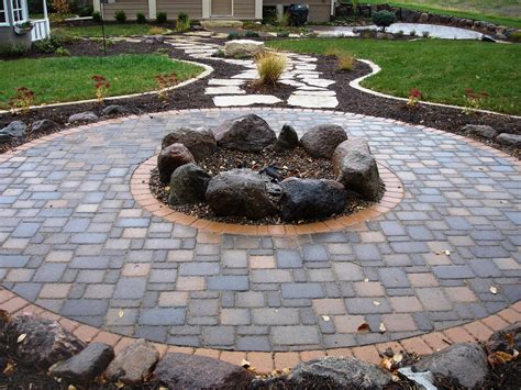 fire pits | Cobble pavers with boulder firepit | Outdoor fire pit designs, Outdoor fire pit ...