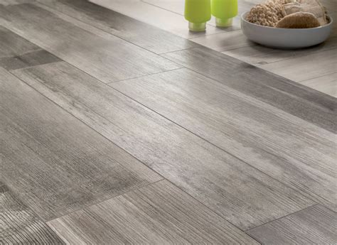 medium-grey-wooden-floor-tiles-closeup - Maggio Adriano - Noleggio autogru in provincia di lecce