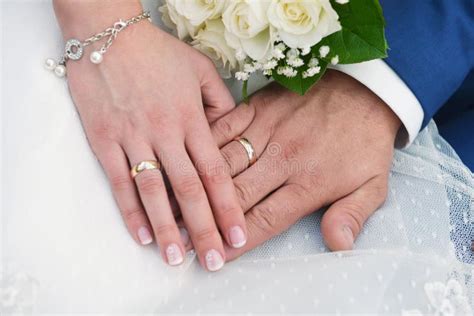 Hands with wedding rings stock photo. Image of bridegroom - 49719536