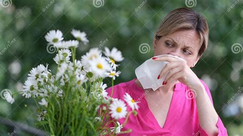 Woman Allergic To Wild Spring Flowers and Holding Bouquet in Hands Stock Image - Image of ...