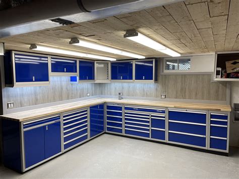 Moduline Blue Pro Aluminum cabinets located in basement. Toolbox, overhead, butcherblock countertop.