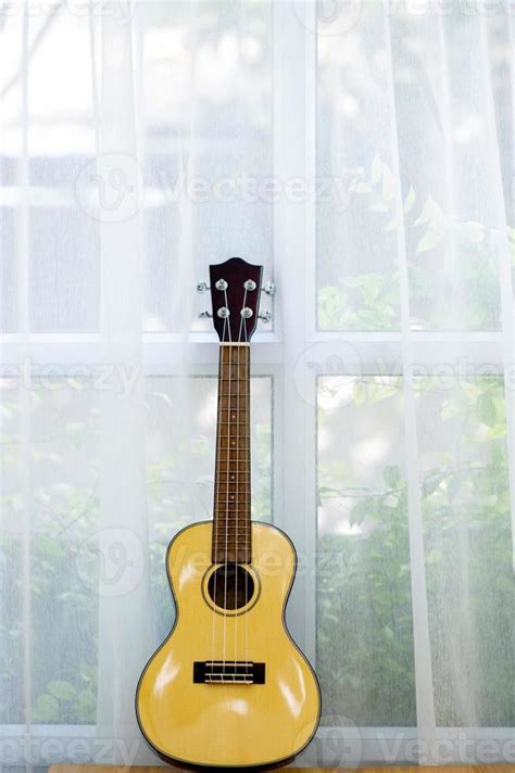 Classical guitar placed in the room 6868596 Stock Photo at Vecteezy