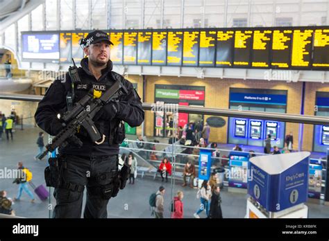 Armed British Transport Police officers on patrol at Kings Cross ...