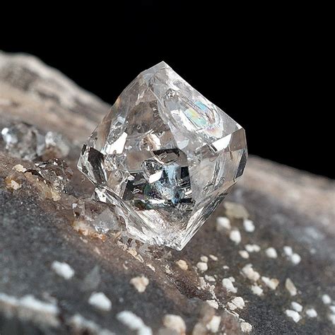 Water clear brilliant single & double terminated rock crystal on dark matrix known as the ...