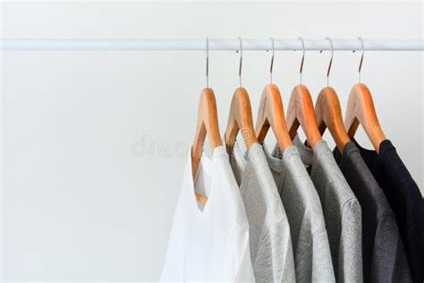 Collection of Black, Gray and White Color Hanging on Wooden Clothes ...