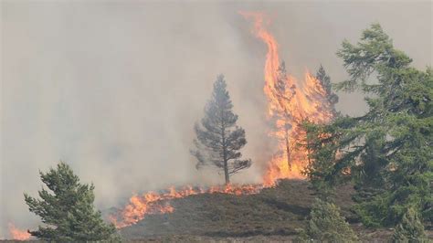 Highland wildfire rages for second day as power outages affect homes ...