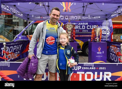 Some Warrington Wolves fans pose for photos next to the Rugby League ...