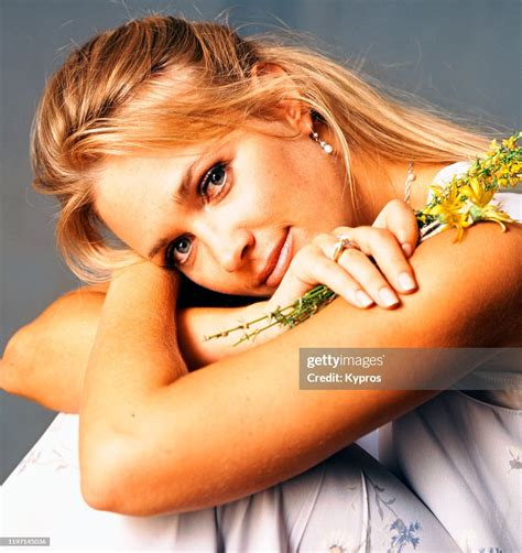 American actress, and former Miss USA, Shannon Marketic, clutching a... News Photo - Getty Images