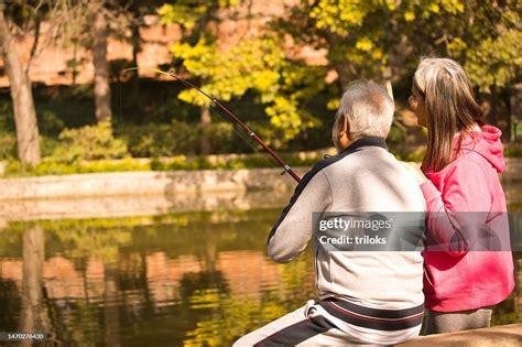 Old Couple Fishing At Lake High-Res Stock Photo - Getty Images