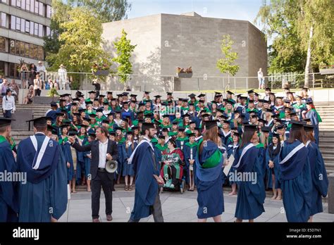 Graduates preparing for a group photograph at UEA ( University of East Anglia ), Norwich England ...