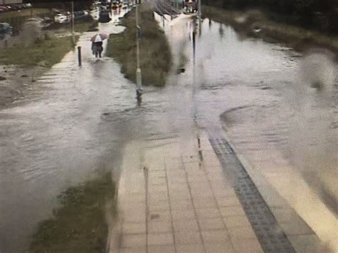 Flash flooding hits Edinburgh leaving cars submerged and drivers stranded as heavy rain batters ...