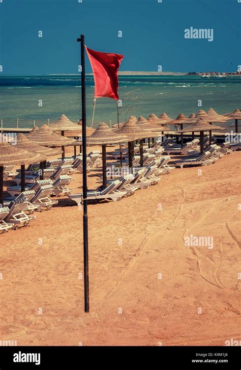 Red warning flag on beach Stock Photo - Alamy