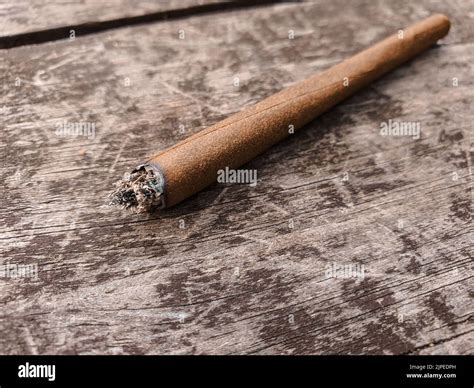 Cannabis joint holding lit hi-res stock photography and images - Alamy