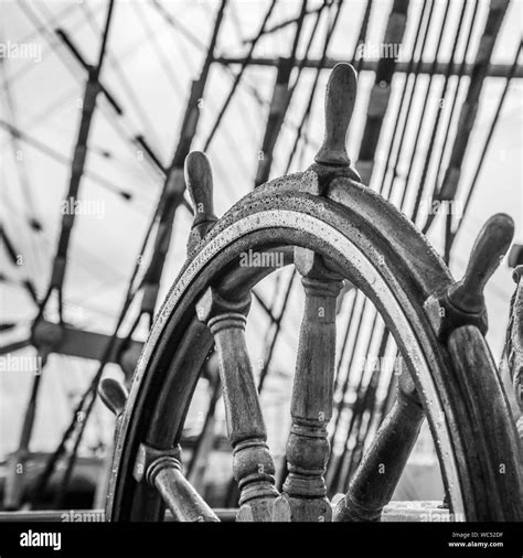 Ship's Bell and wheel the old sailboat, close-up Stock Photo - Alamy