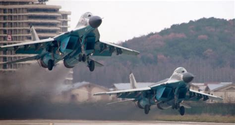 North Korea flies 12 fighter jets and bombers in apparent firing drills ...