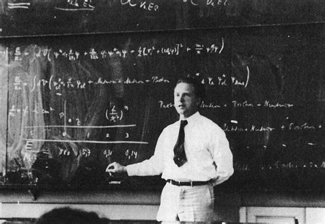 15 physicists in front of their blackboards