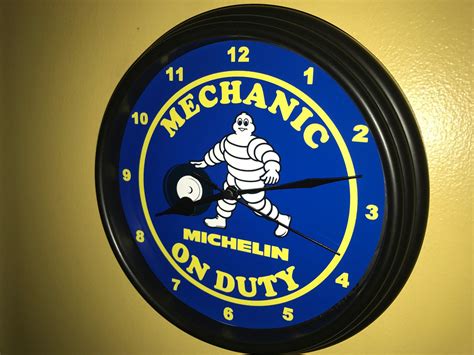 Michelin Tires Mechanic on Duty Service Gas Station Garage Bar ...