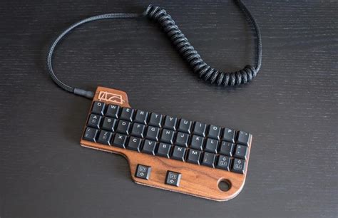 A little keyboard I've made for myself... hand-wired, walnut wood ...