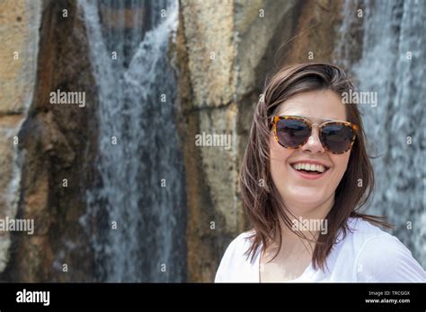 woman laughing by a waterfall Stock Photo - Alamy