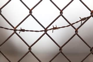 Prison Fence with Barbed Wire | Prison or Jail fence outside… | Flickr