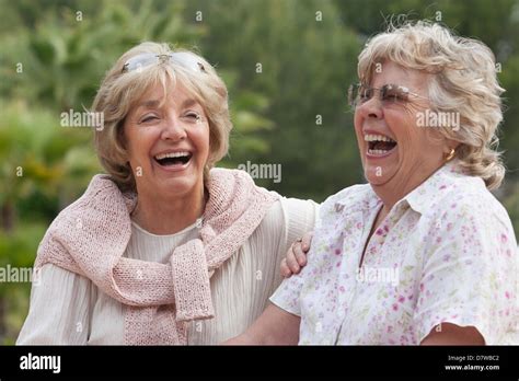 Elderly women laughing together Stock Photo - Alamy