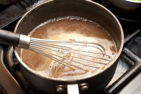 Gravy simmering in sauce pan - Free Stock Image