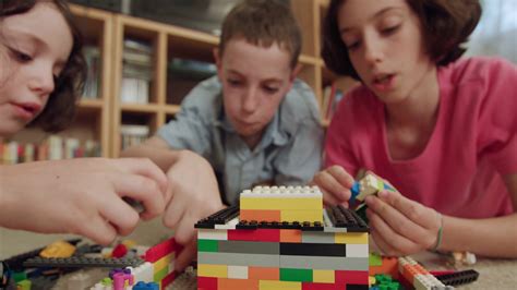 Three Kids Playing With Lego Bricks At Home Stock Footage SBV-327184178 - Storyblocks