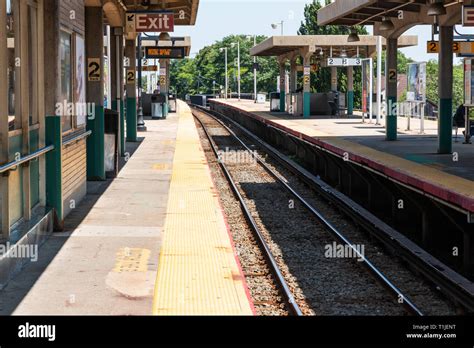 Babylon, New York, USA - 14 August 2018: Babylon Railroad station platform looking west down the ...