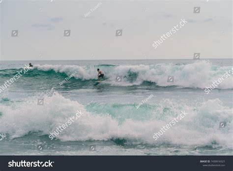 Montanita, Ecuador - Feb 2019: Surfers surfing the waves on beautiful ...